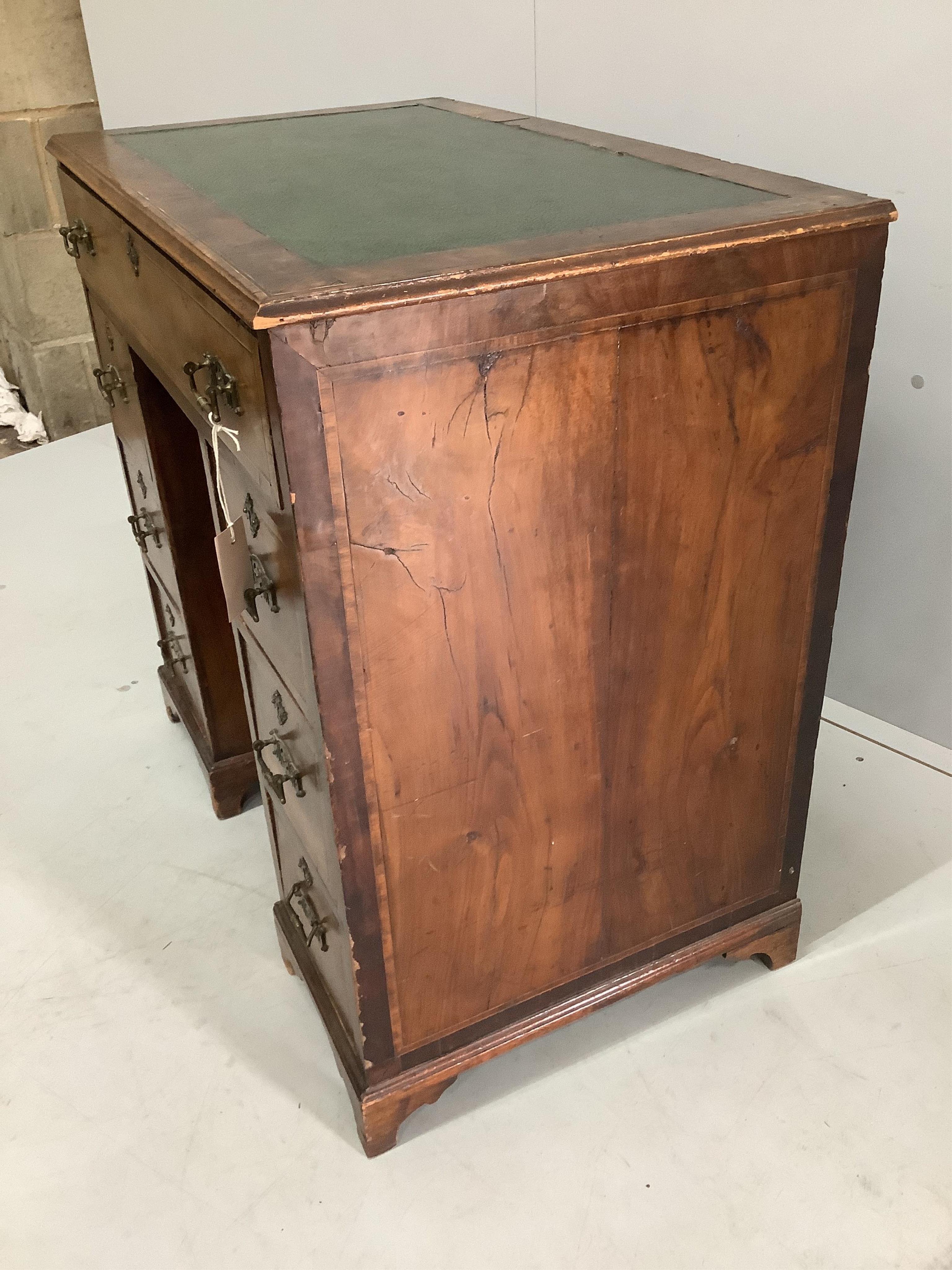 An 18th century and later inlaid walnut kneehole desk, width 77cm, depth 46cm, height 75cm. Condition - fair